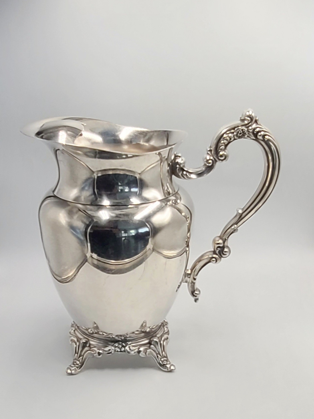 Oneida Silver Pitcher with Ornate Scroll Handle